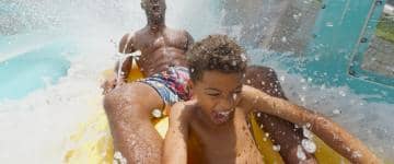 Family enjoy a water coaster